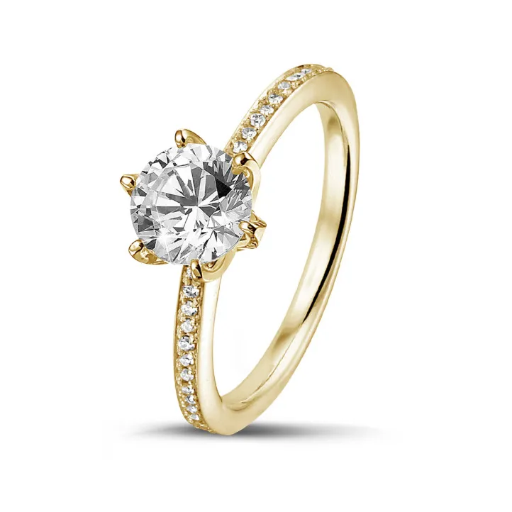 0.70 quilates anillo solitario en oro amarillo con diamantes en los lados 