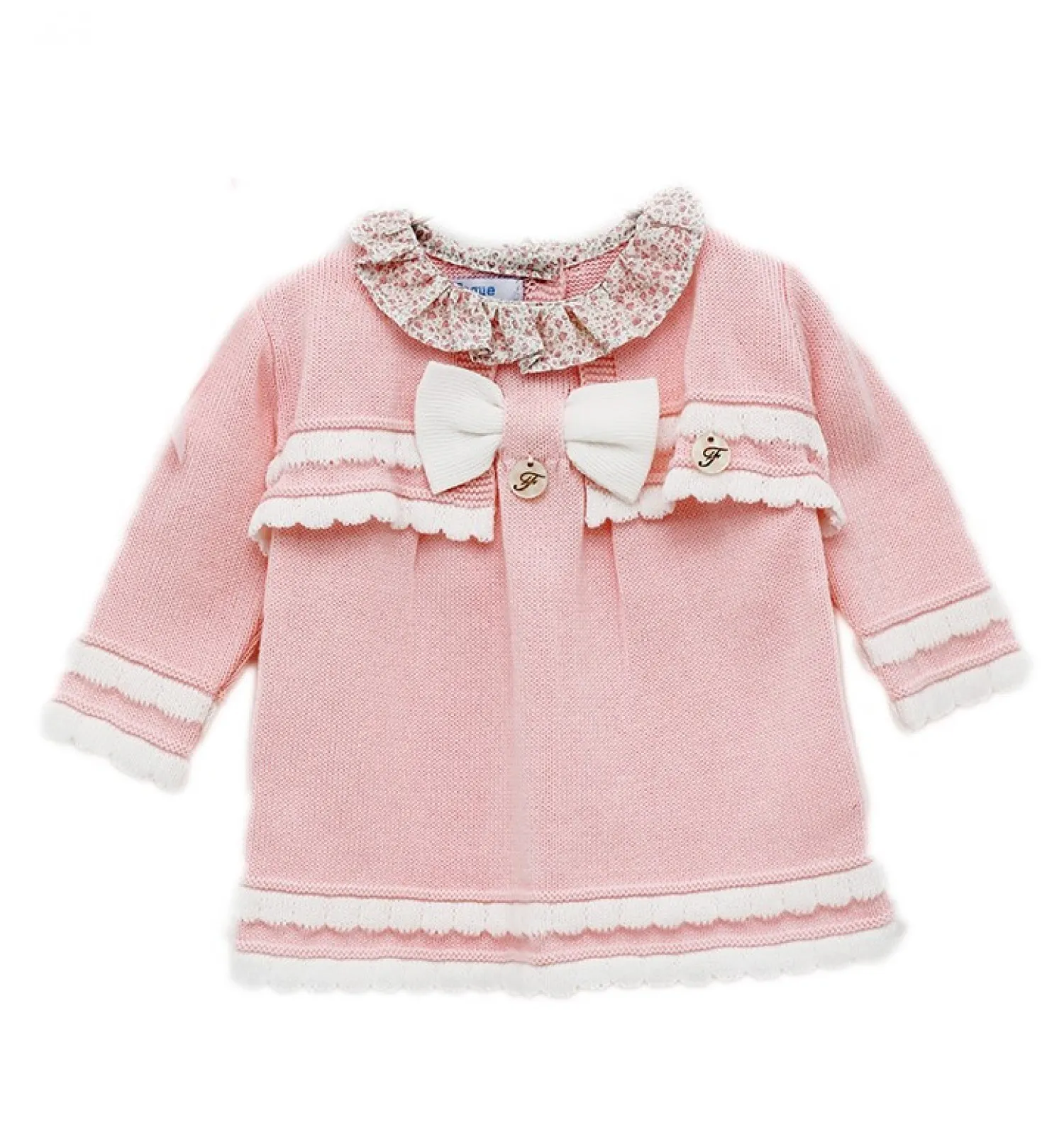 Conjunto de Vestido y chaqueta color rosa con blanco.