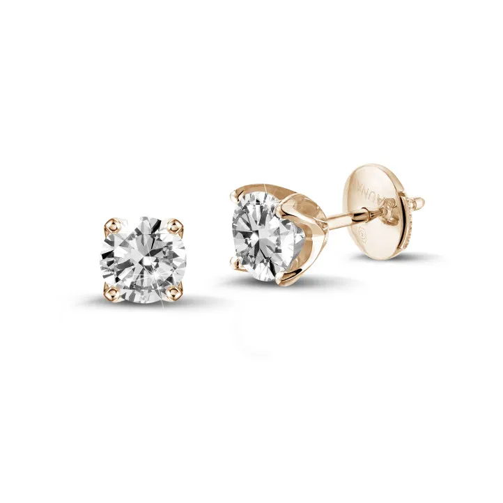 pendientes solitarios en oro rojo con diamantes redondos de 0.30 qt cada uno 